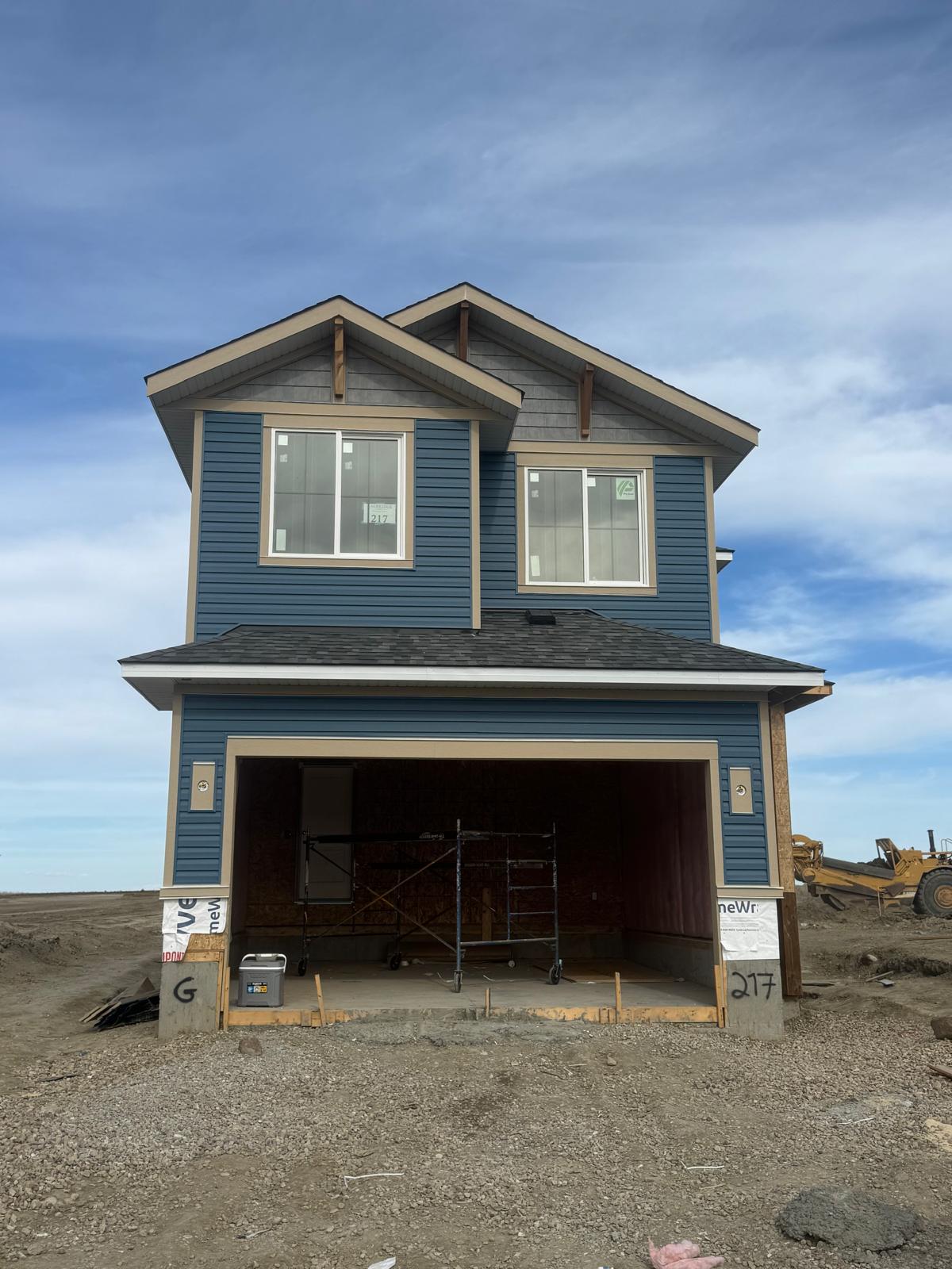 Completed vinyl siding project on a suburban Calgary home