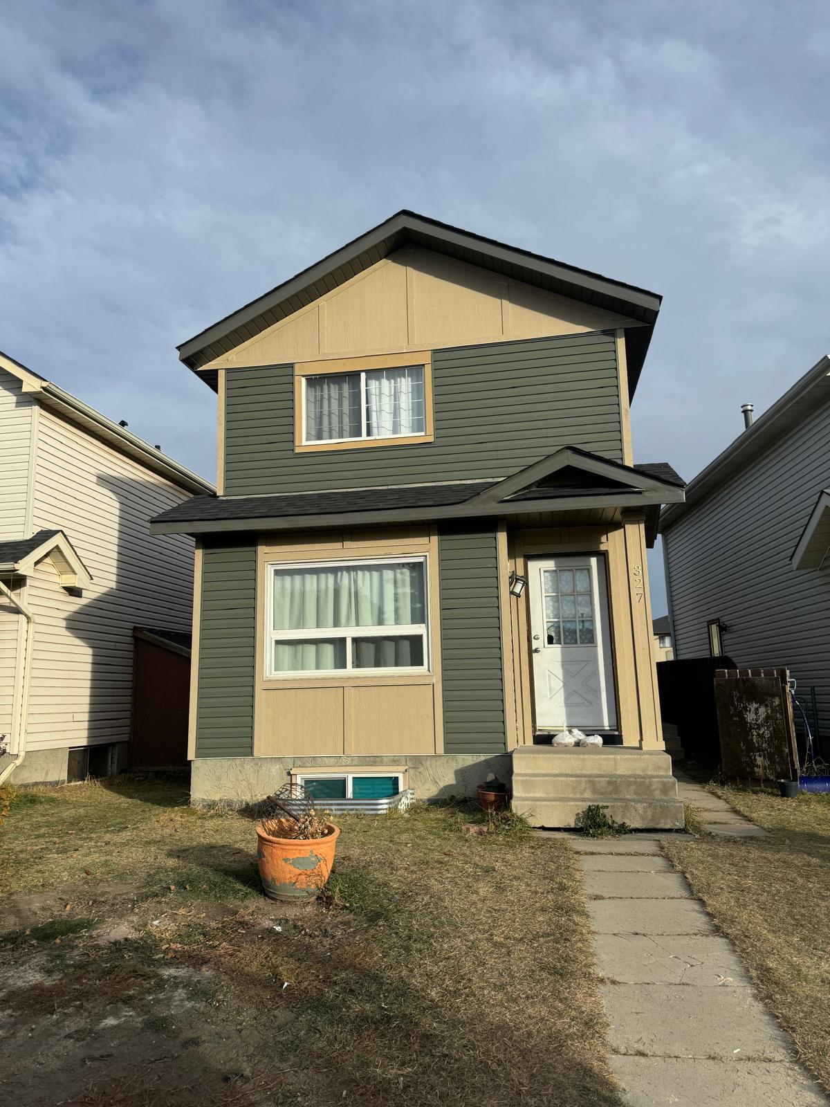Exterior renovation of a Calgary home with new siding and trim
