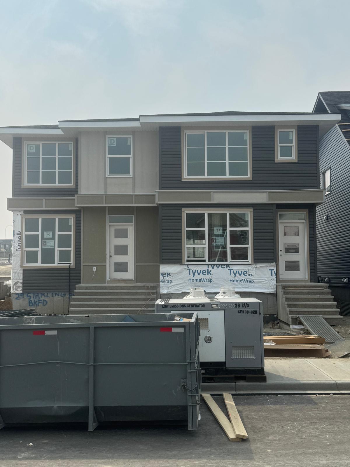 Close-up of hail damage on vinyl siding in Calgary