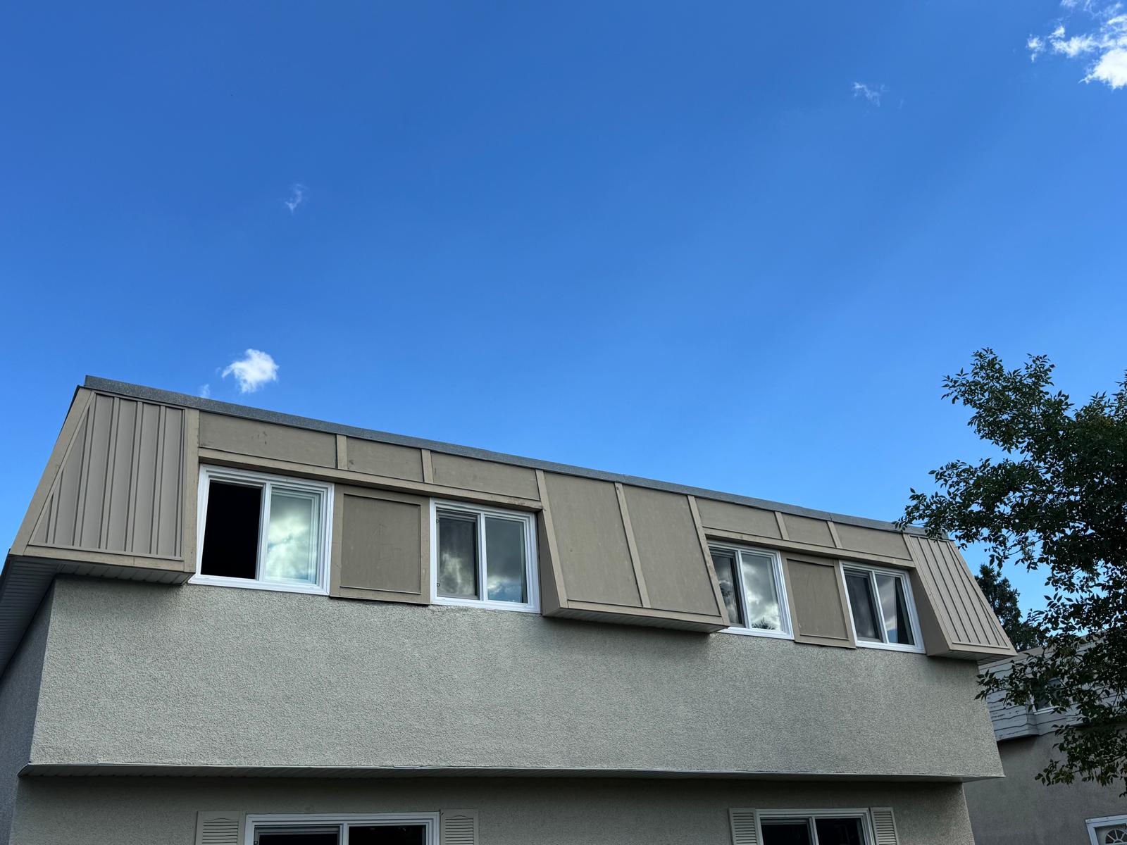 Full view of a two-story Calgary house with new blue James Hardie siding