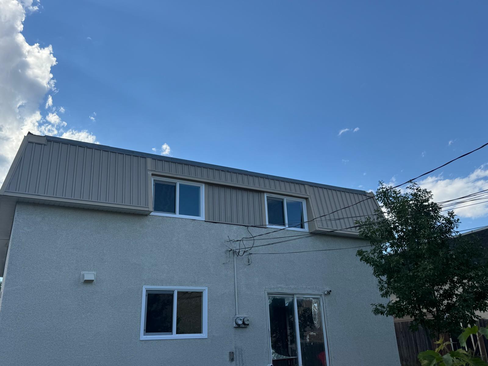 Siding renovation project in progress on a Calgary home